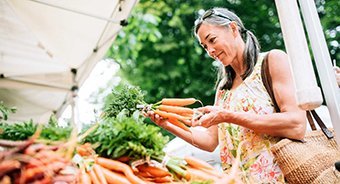 Woman picking out carrots