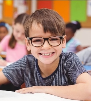 Smiling child wearing glasses