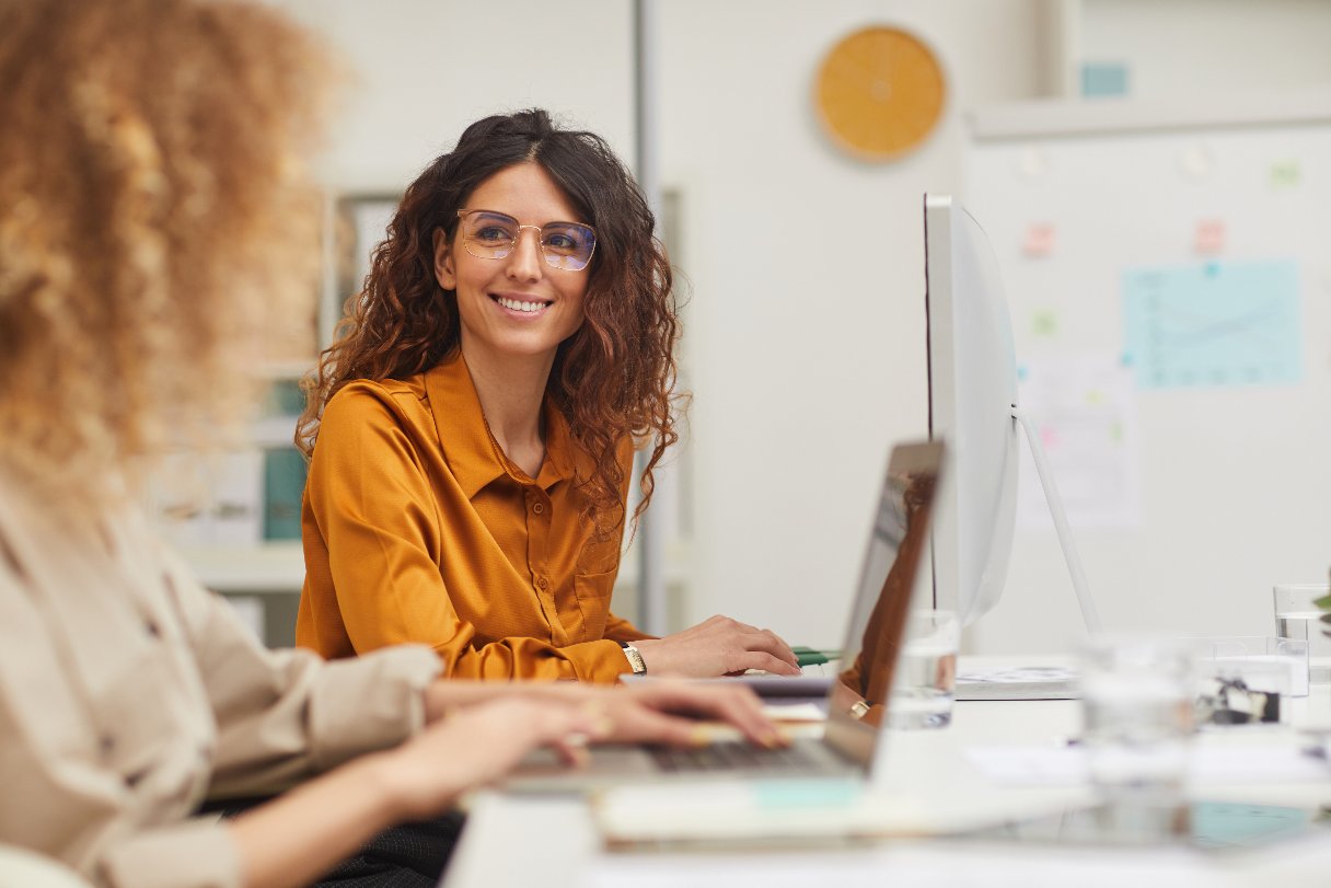 Woman in glasses working at a computer