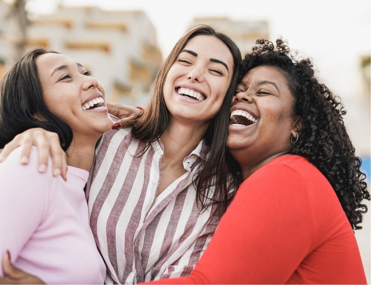 Group of women, laughing together