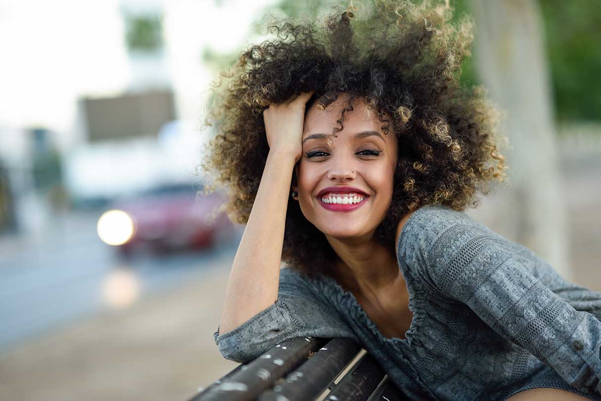 Woman outside, smiling