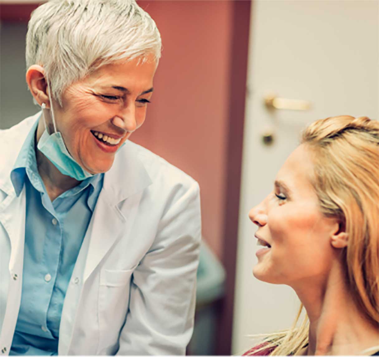 Two women speaking in a medical setting