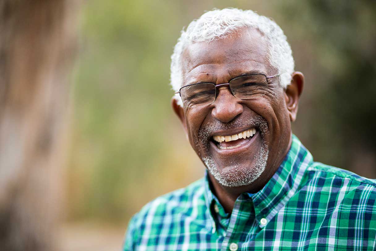 Man in glasses laughing