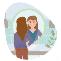 Woman looking at herself in a mirror