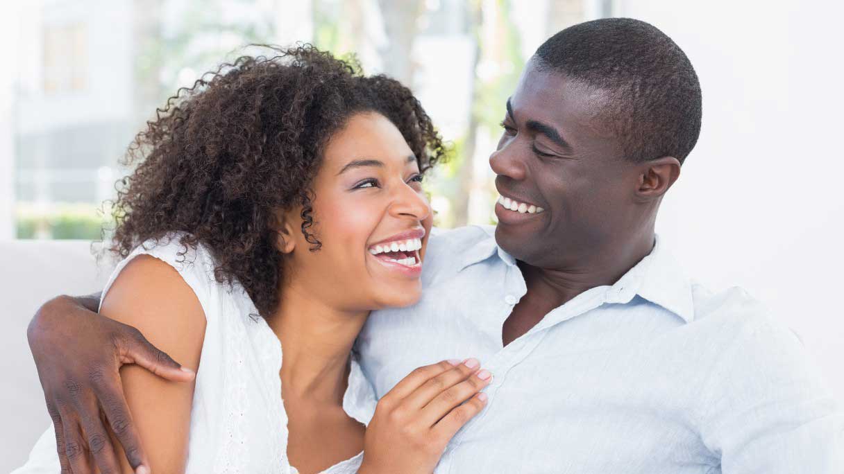 Woman and man smiling with white teeth