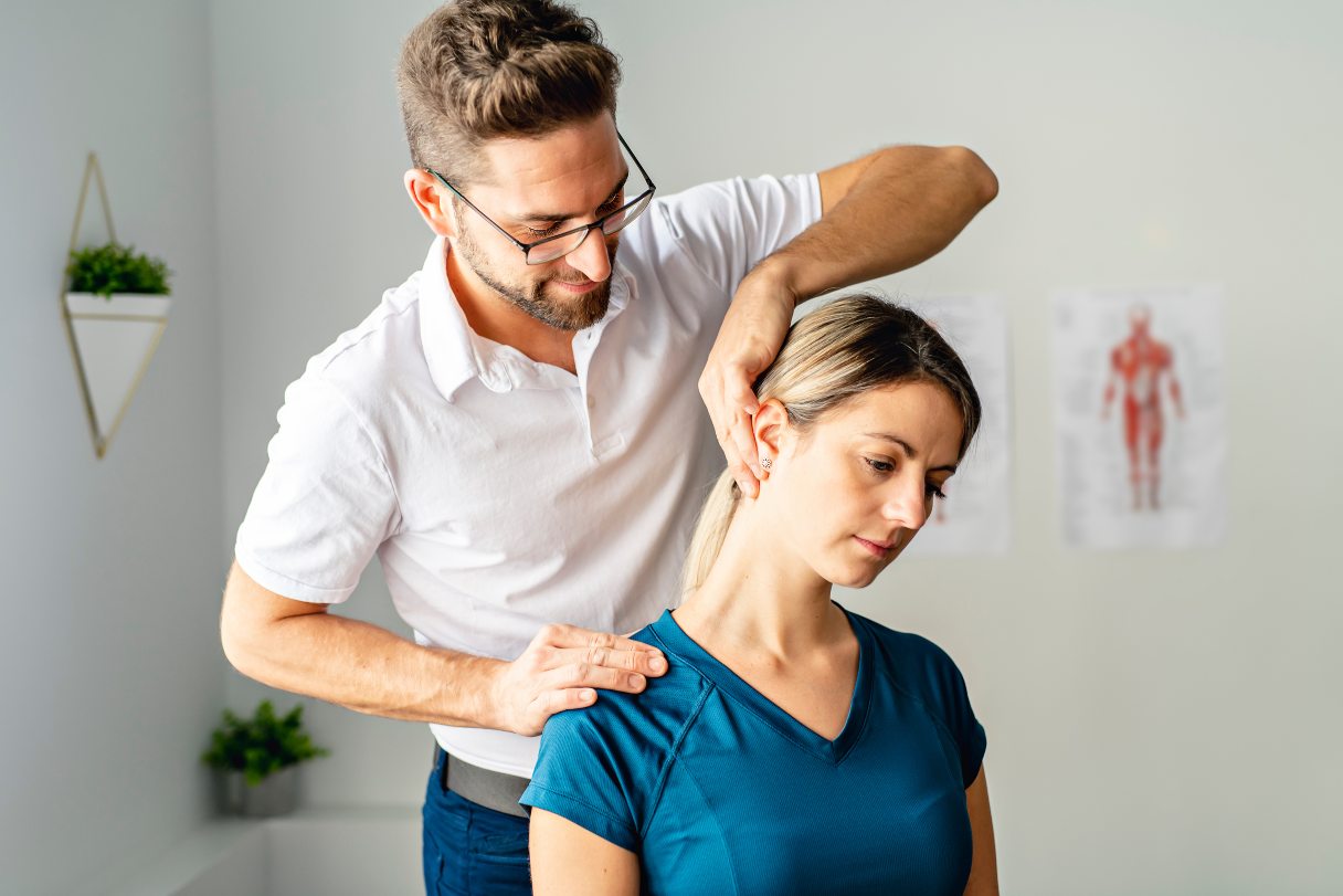 Chiropractor adjusting a woman's neck