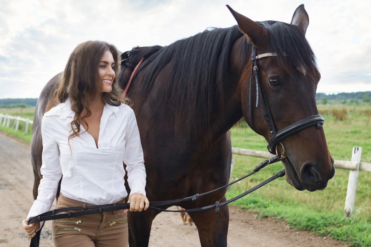 Woman walking with horse