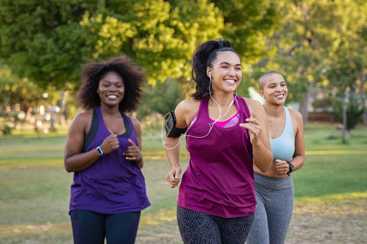 Three women running outside