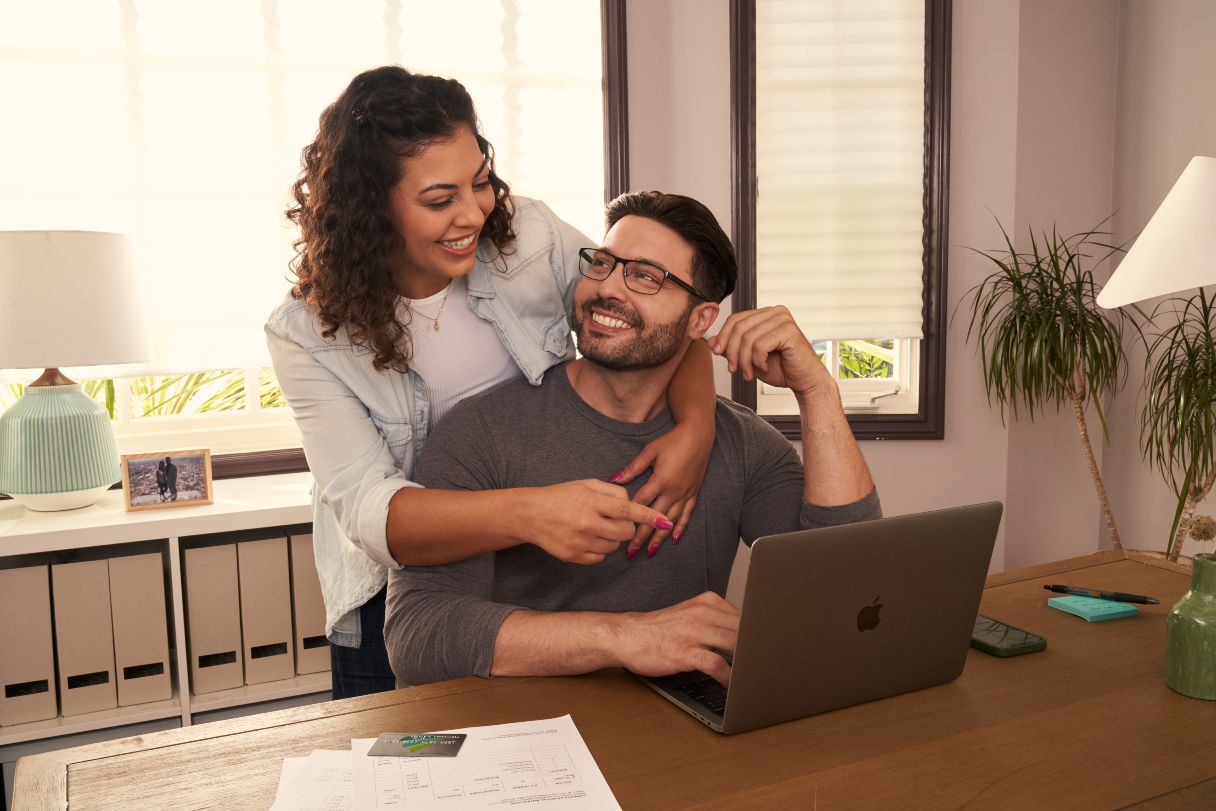 Man and woman working at laptop