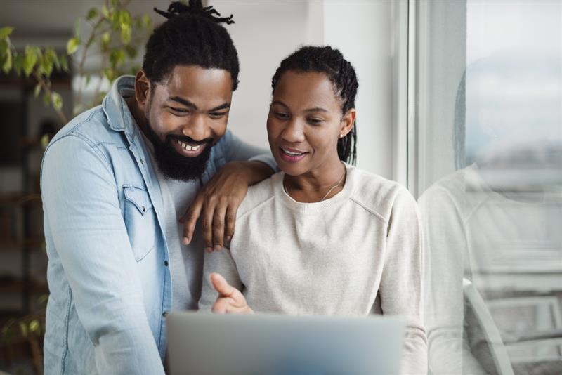 Man and woman looking at computer screen