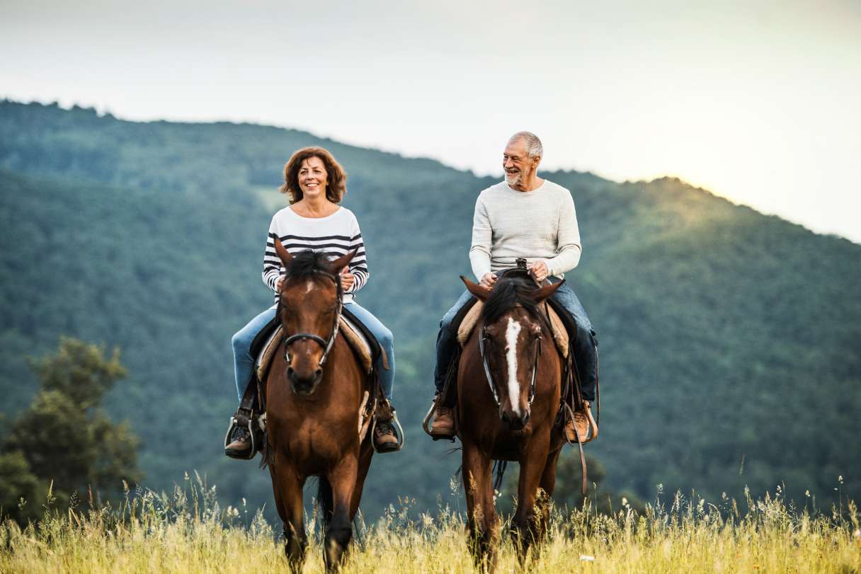 Man and woman riding horses