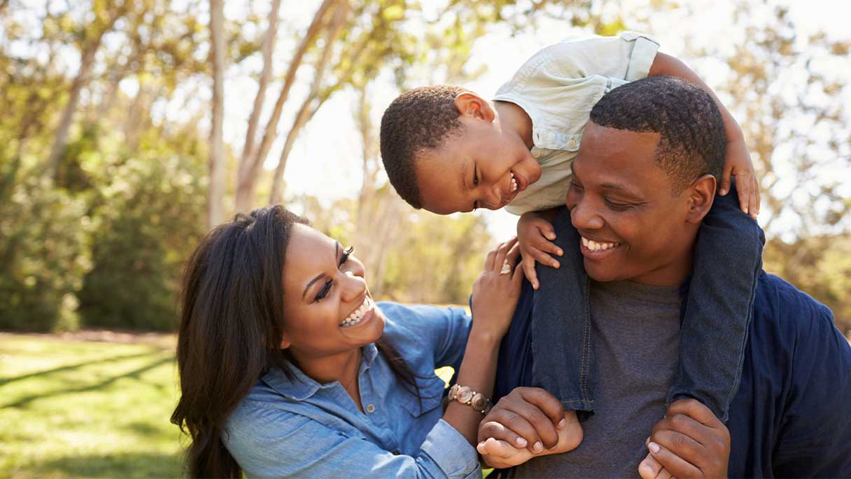 Family in park, smiling