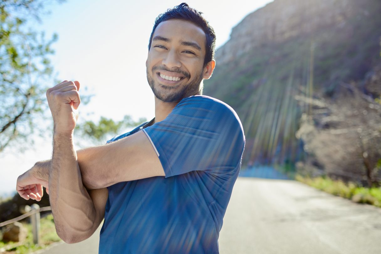 Man stretching outside