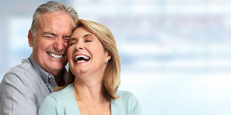 Senior man and woman laughing together