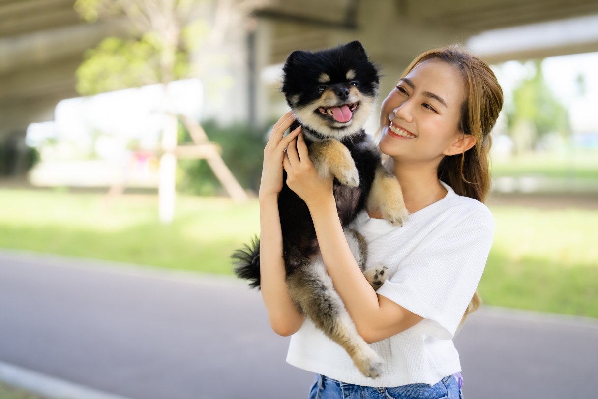 Woman holding a dog