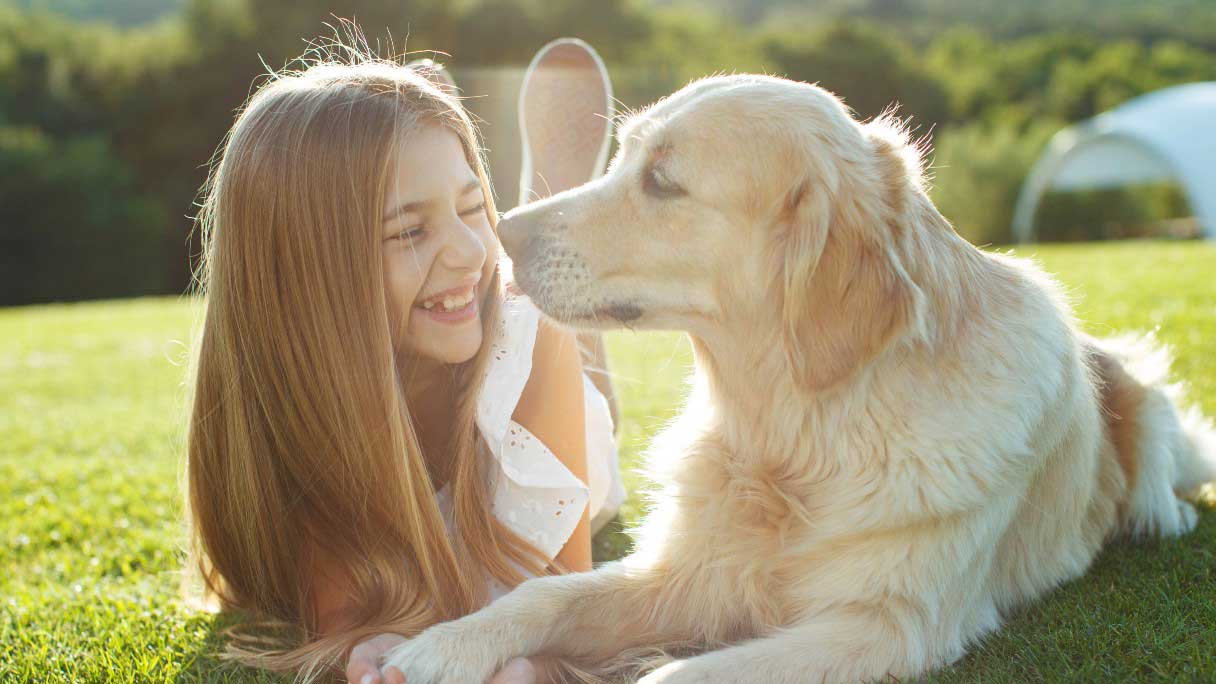 Small girl with dog in park