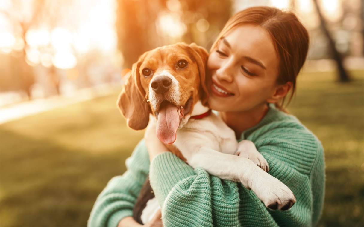 Woman with dog smiling