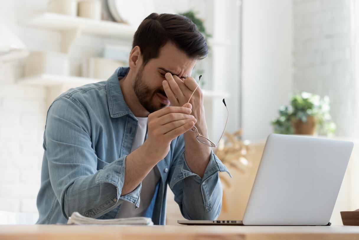 Man rubbing his eyes