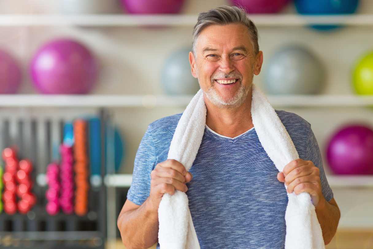 Man in gym, smiling