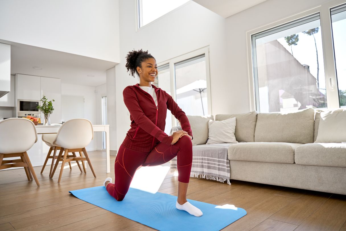 Woman lunging on a yoga mat