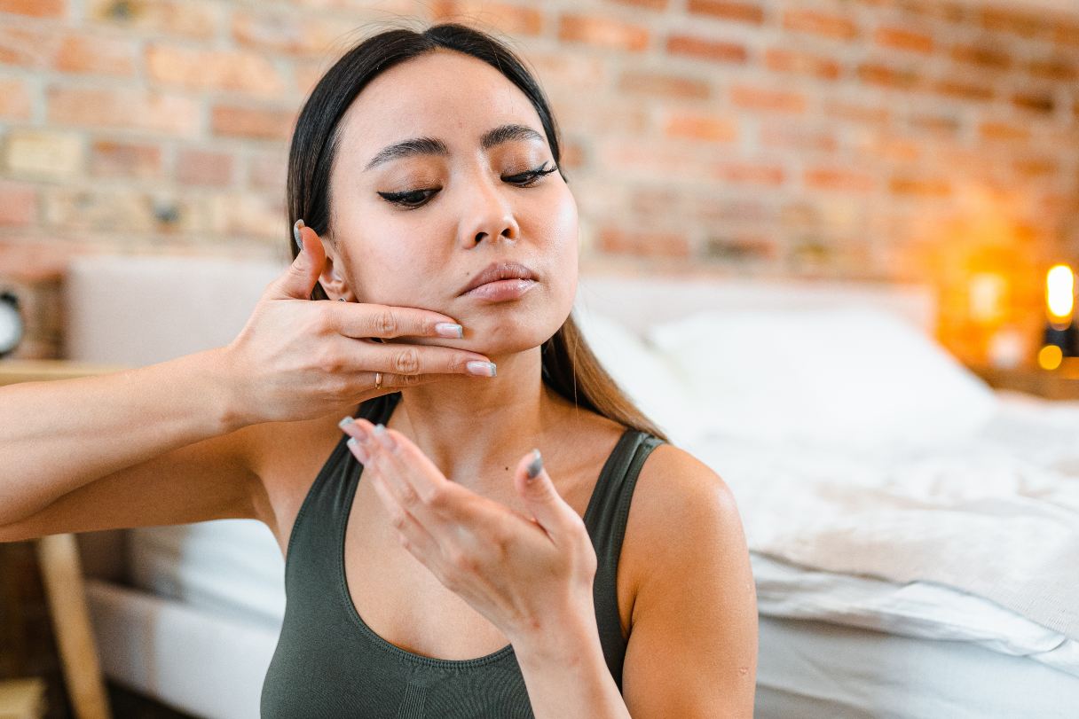 Woman massaging her face