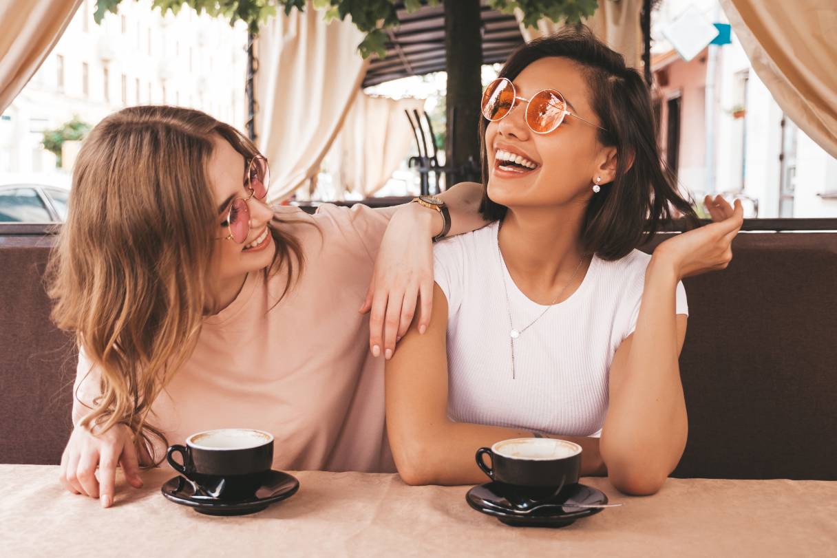 Two women drinking coffee together