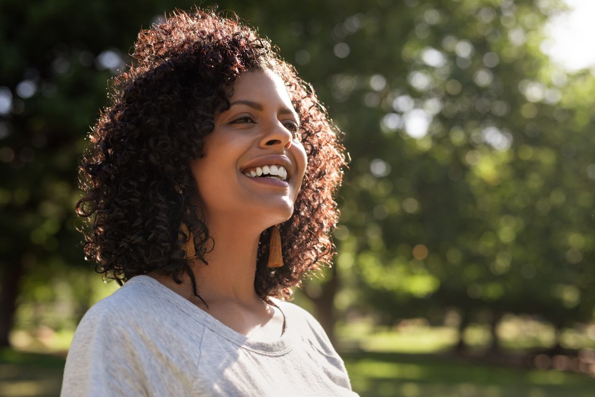 Woman outside, smiling