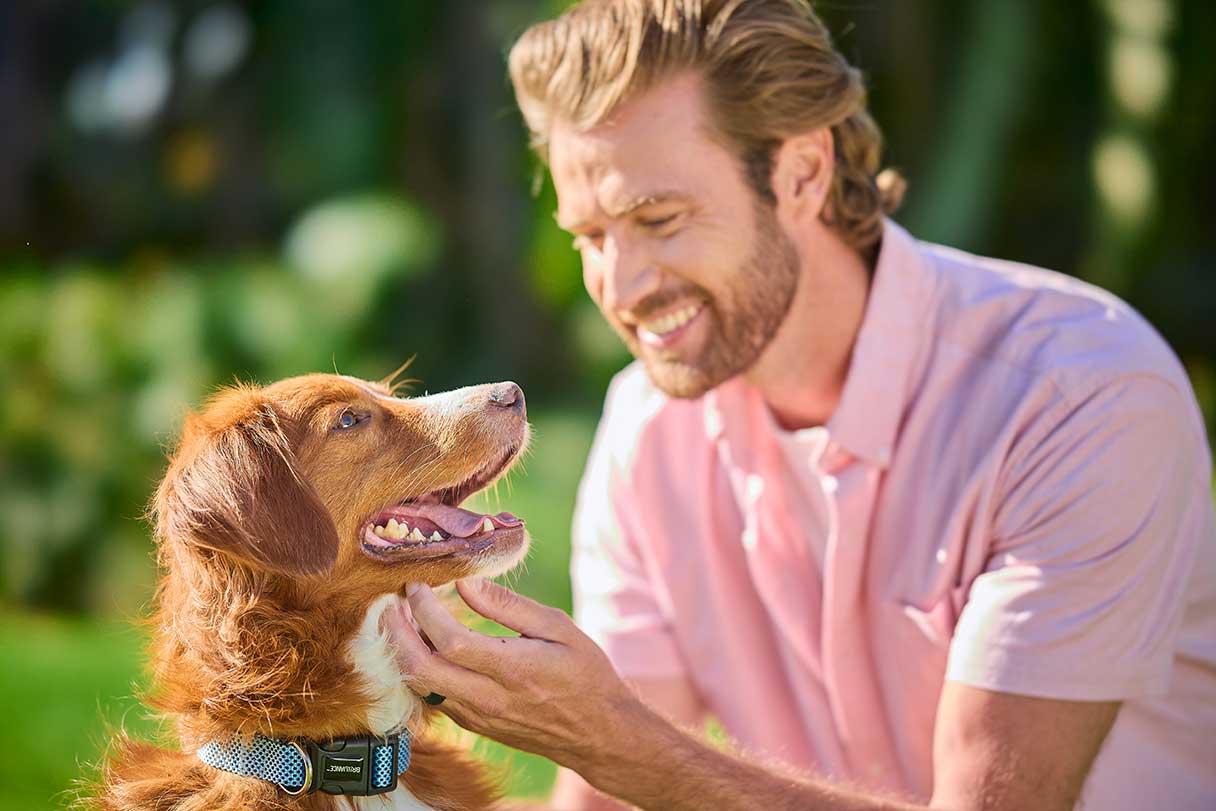 Man smiling at a dog
