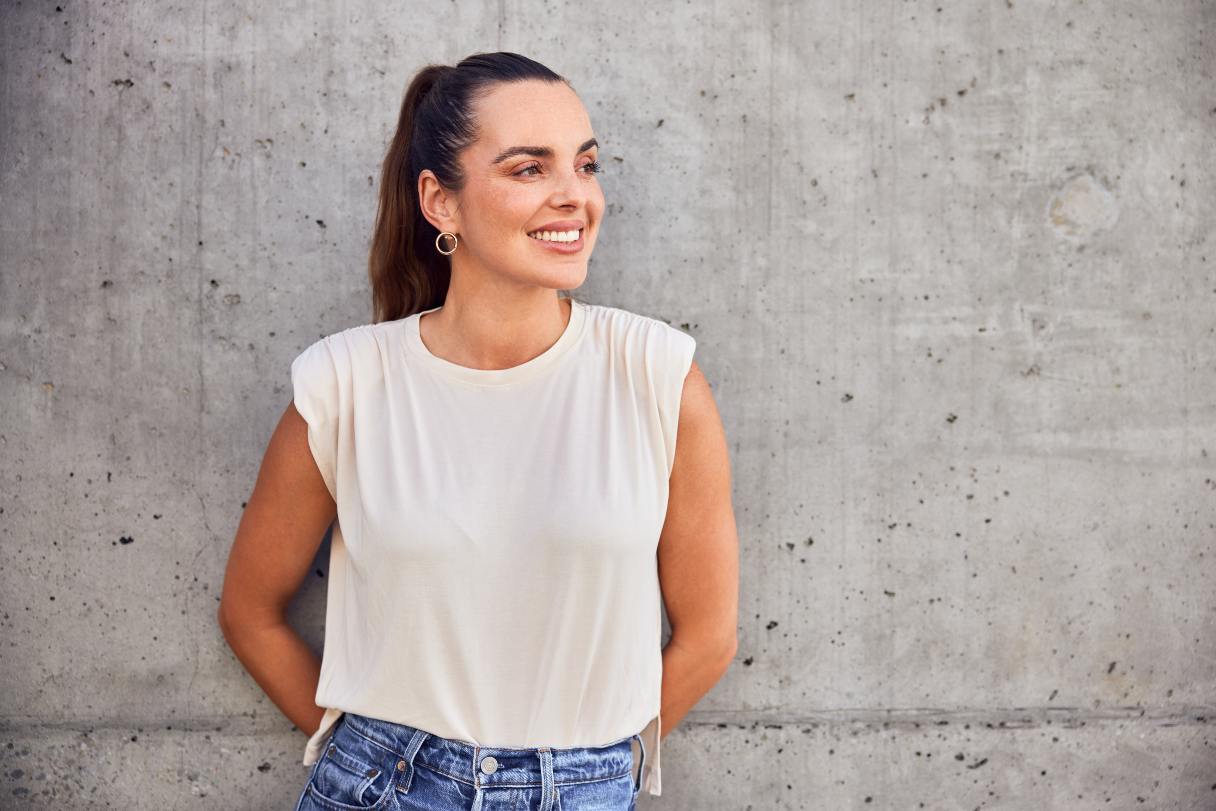 Smiling woman, standing outside
