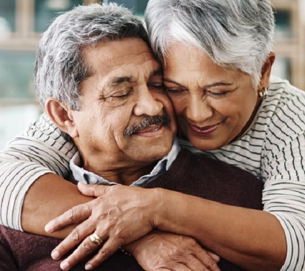 Woman embracing a man from behind