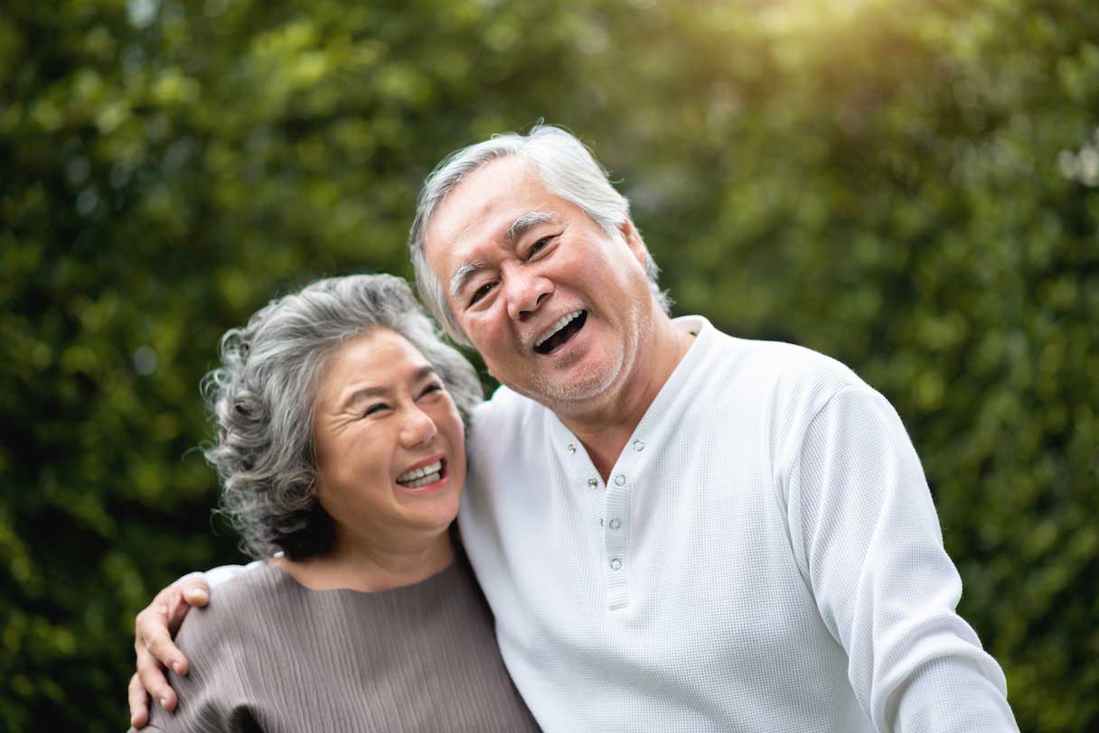 Senior man and woman smiling together