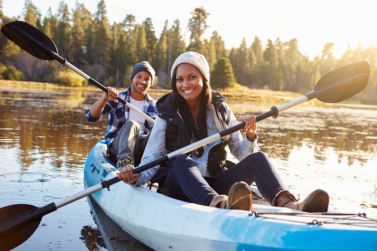 Smiling couple in a canoe