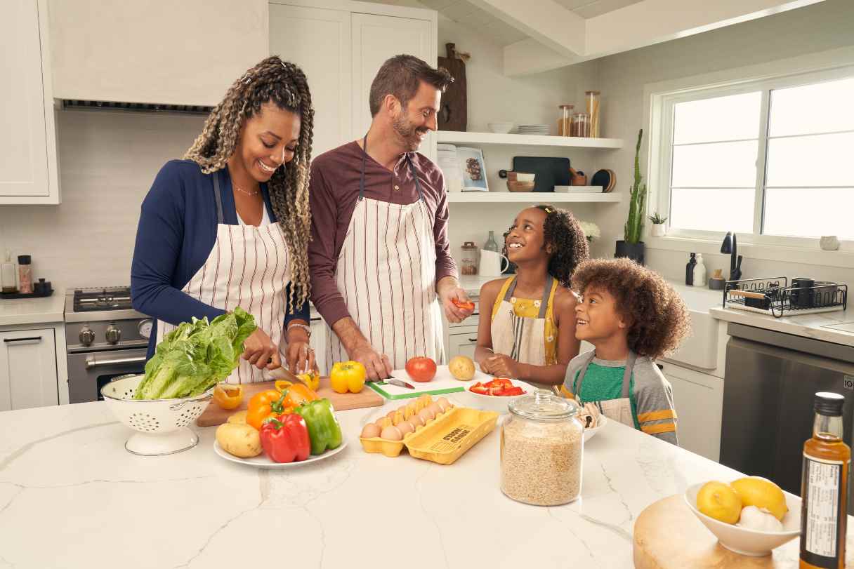 Family cooking together in kitchen