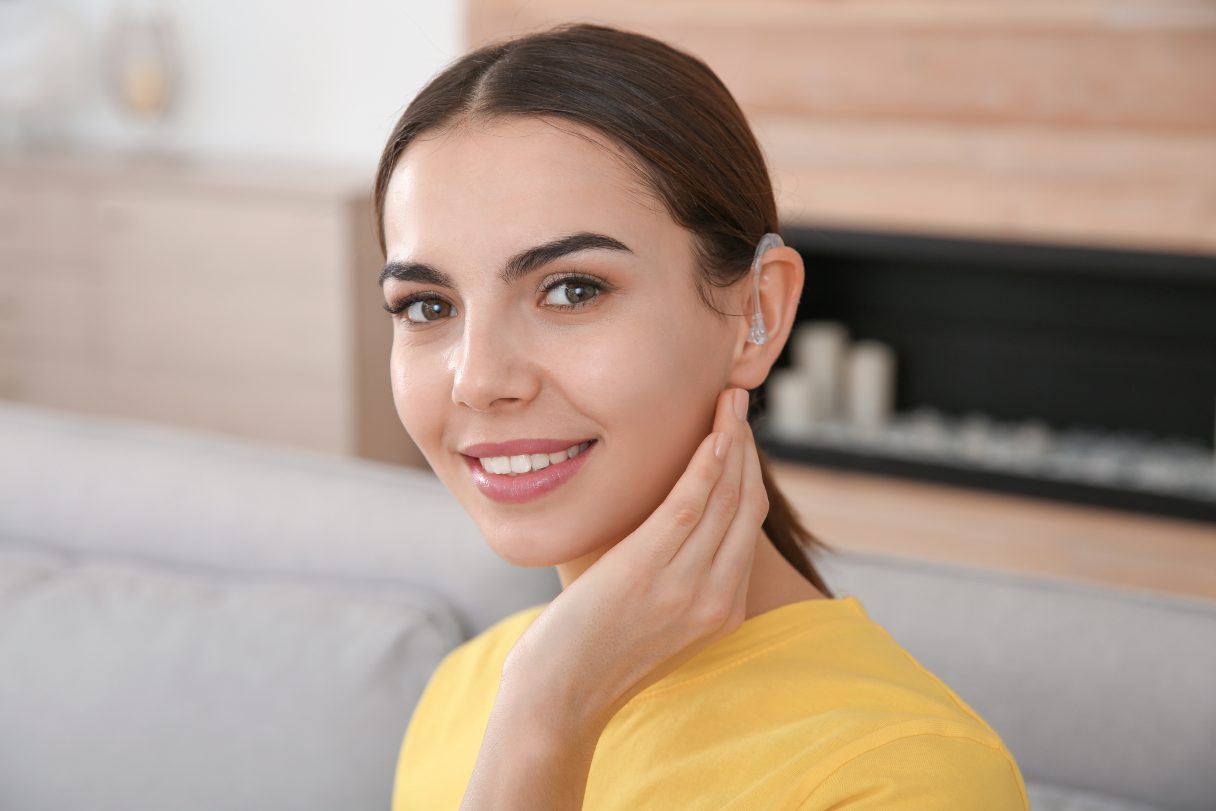 Woman with hearing aid in her ear