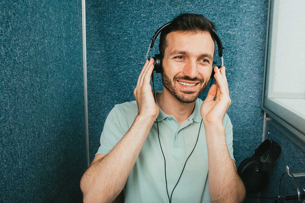 Man with headphones on, performing hearing test