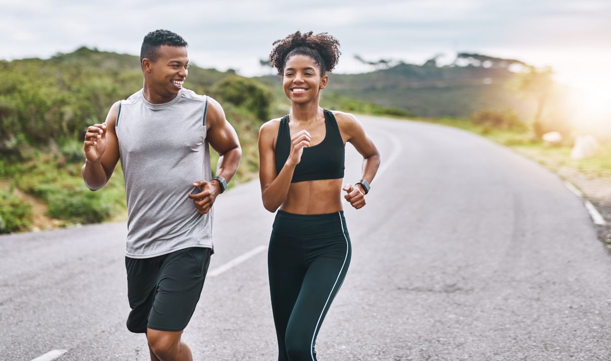 Man and woman running outside