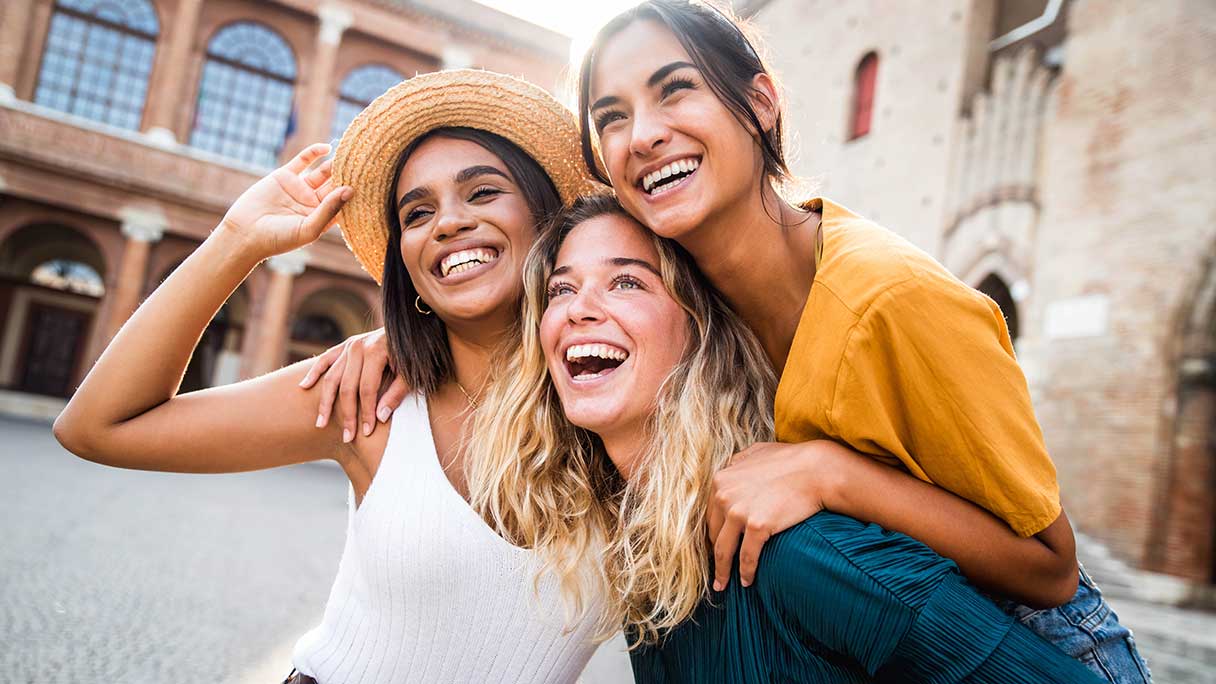Group of young women outside, smiling