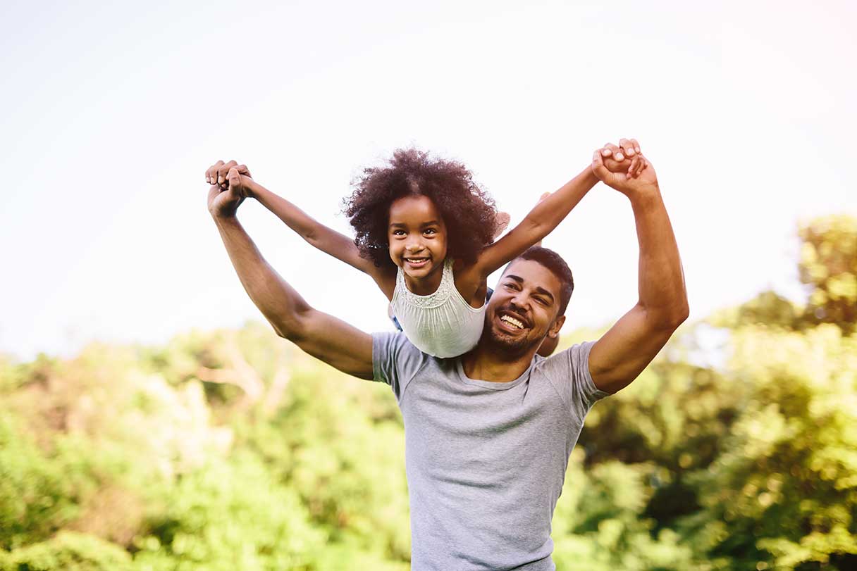 Man with a young girl on his shoulders