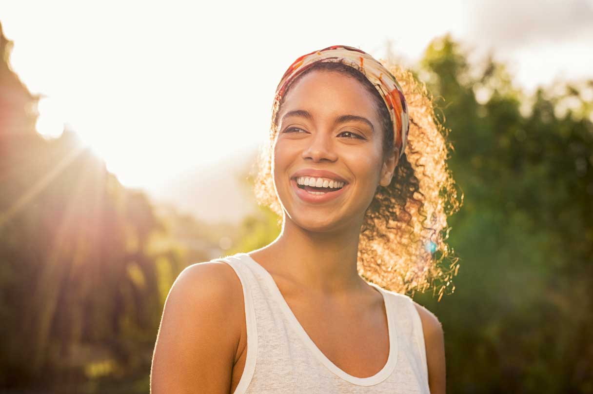 Woman outside, smiling