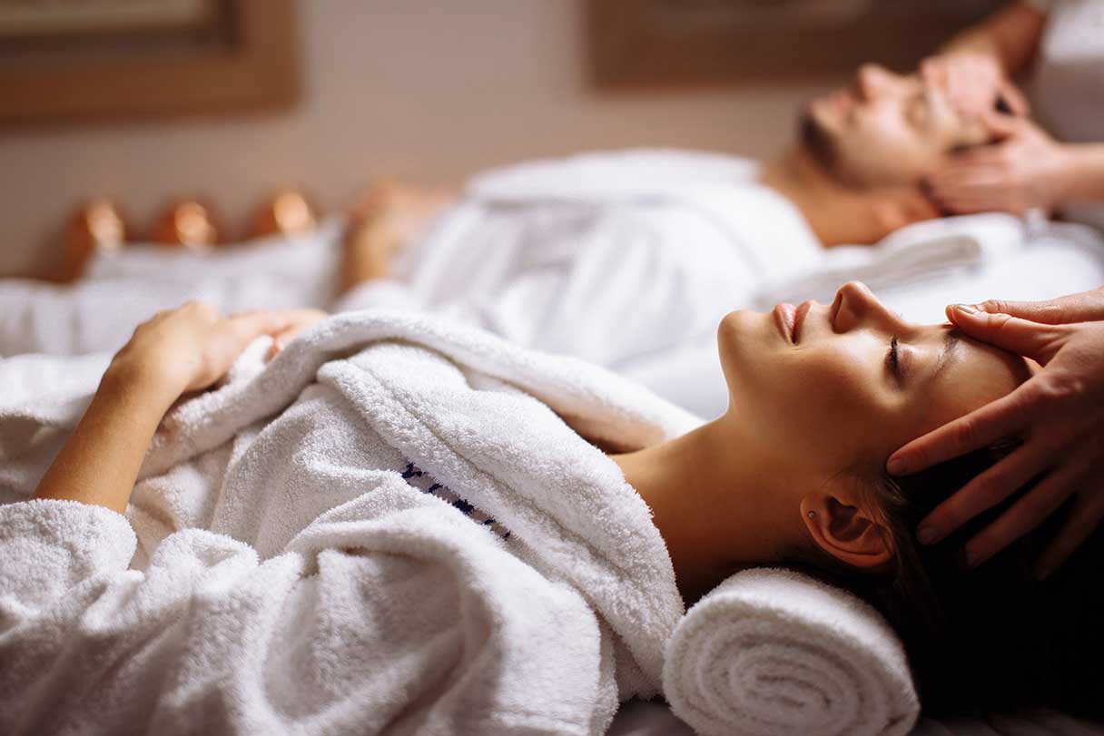 Couple receiving massage services together