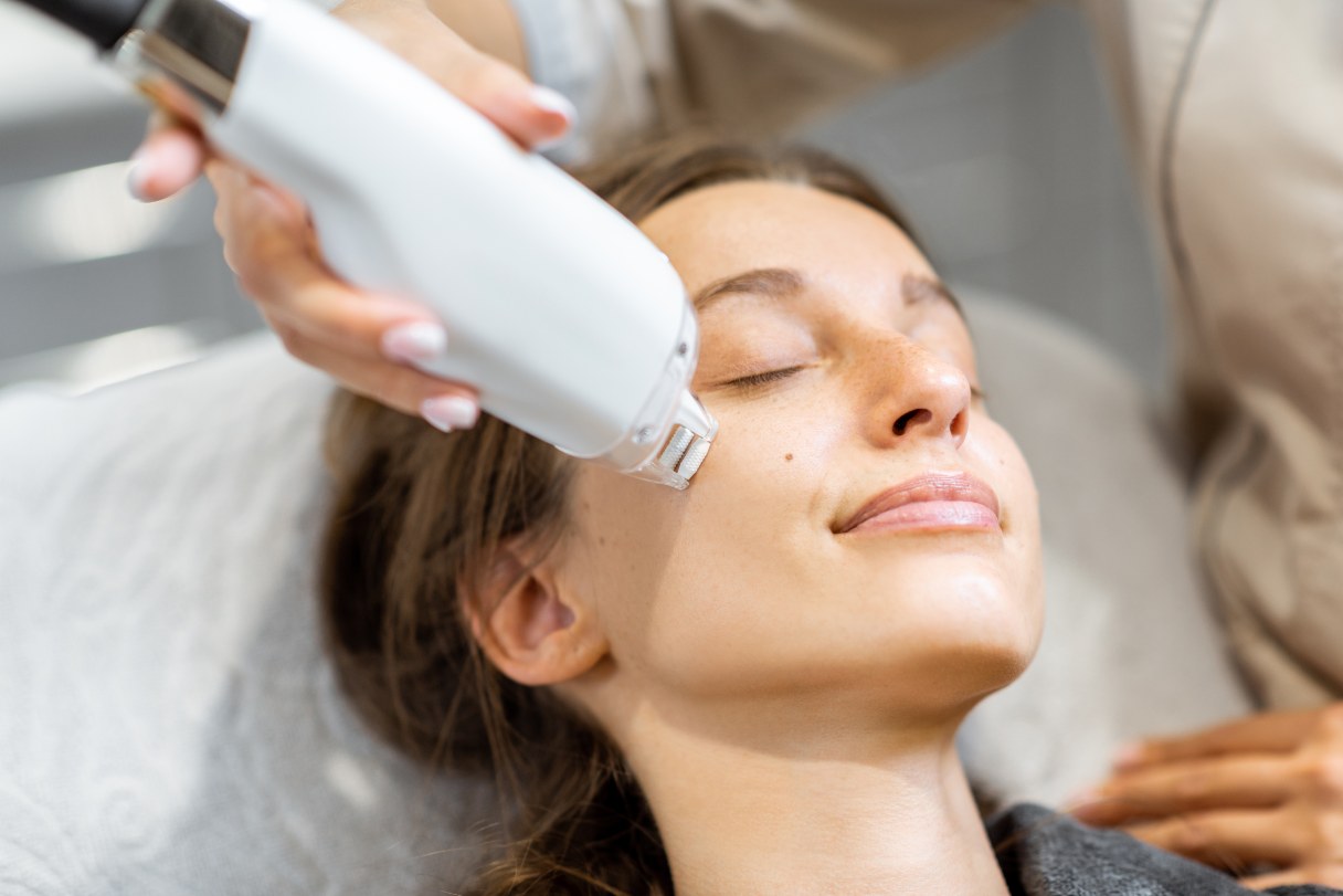 Woman having mole removed
