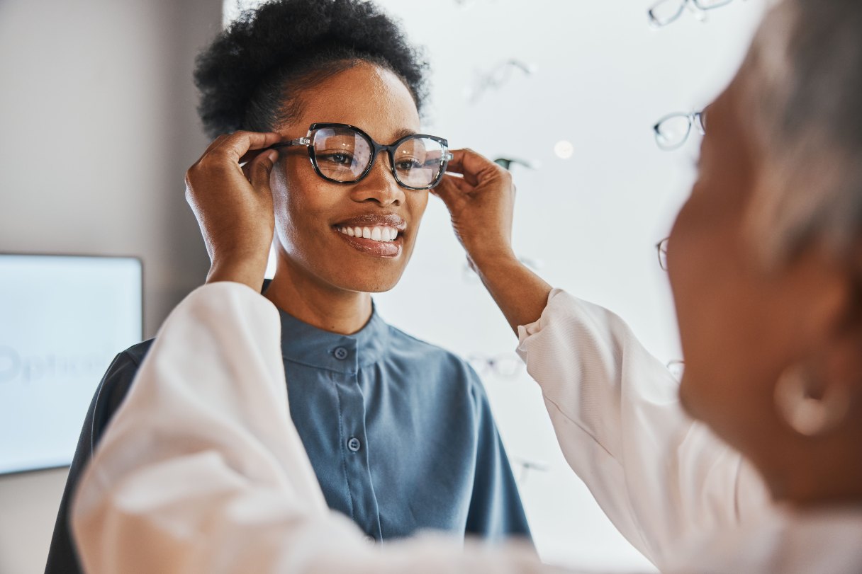 Woman being fitted with glasses