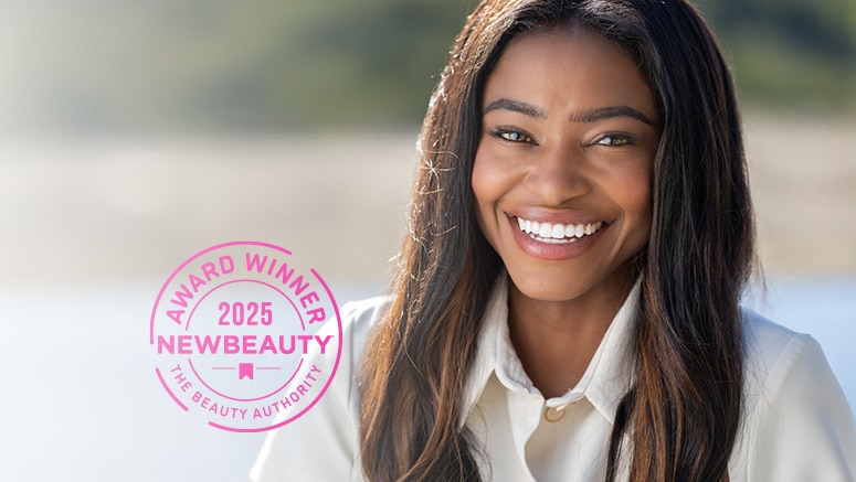 Smiling woman with New Beauty award seal