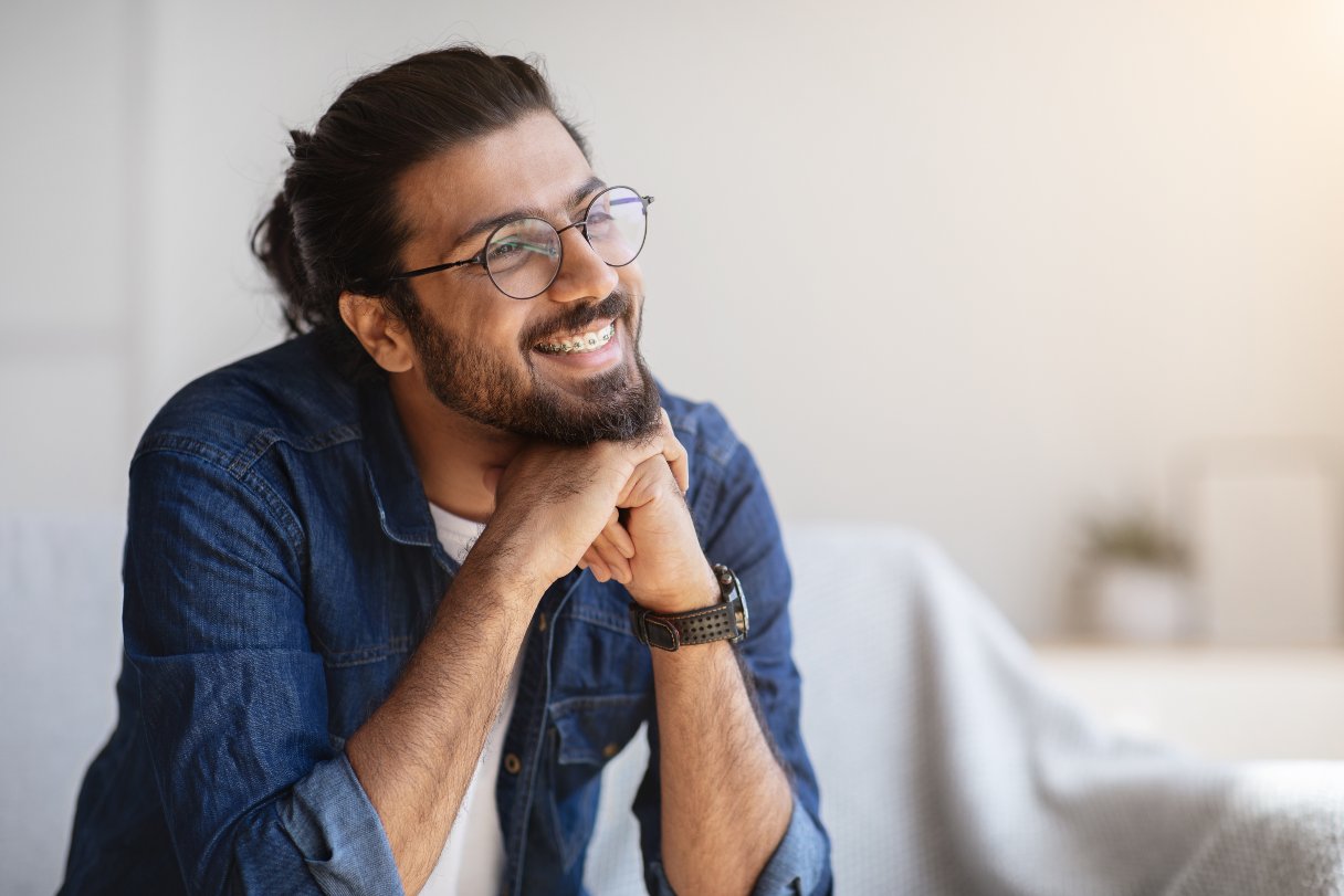 Man with braces, smiling