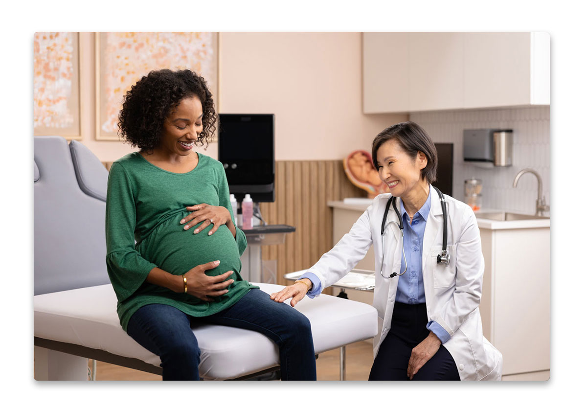 Pregnant woman speaking to healthcare provider