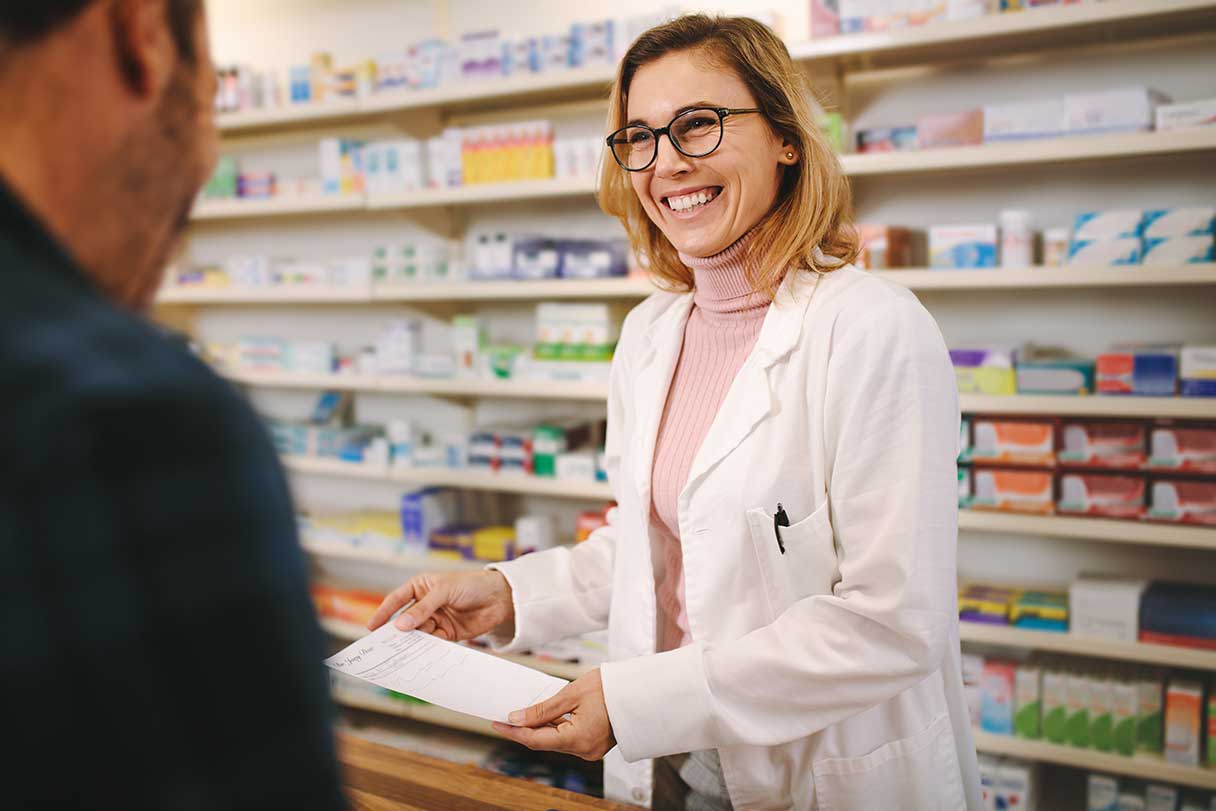 Pharmacist assisting client