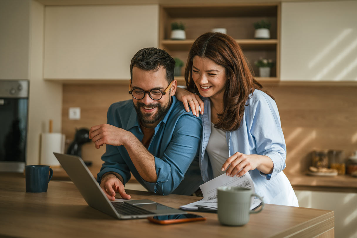 Man and woman working on laptop