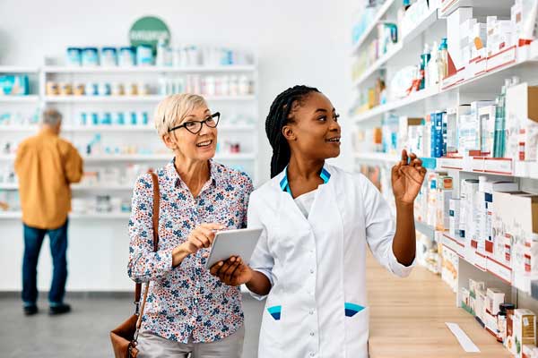 Pharmacist helping woman