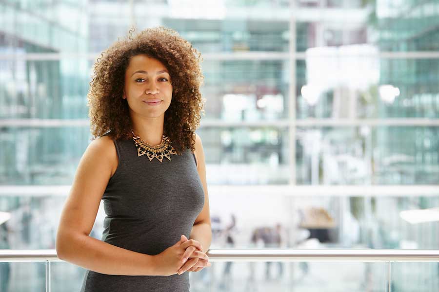 Woman in modern building, smiling