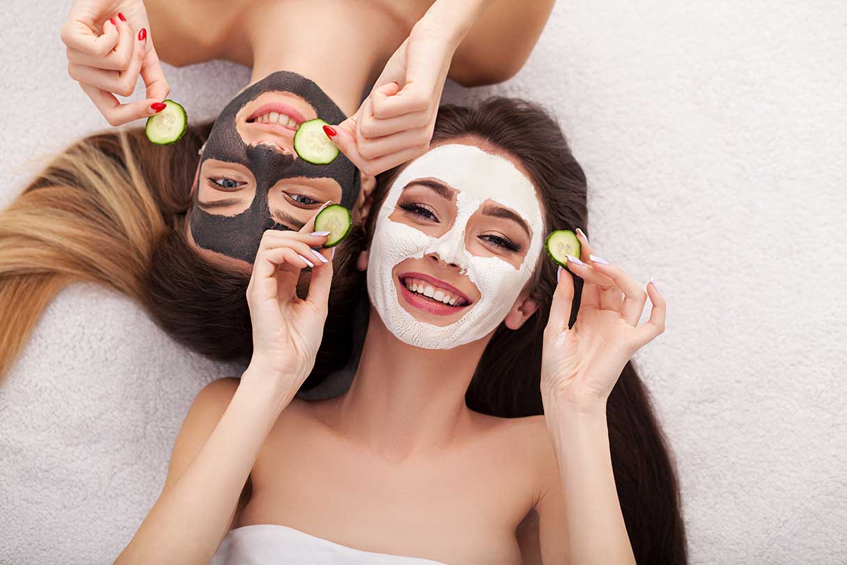 Two women with face masks on